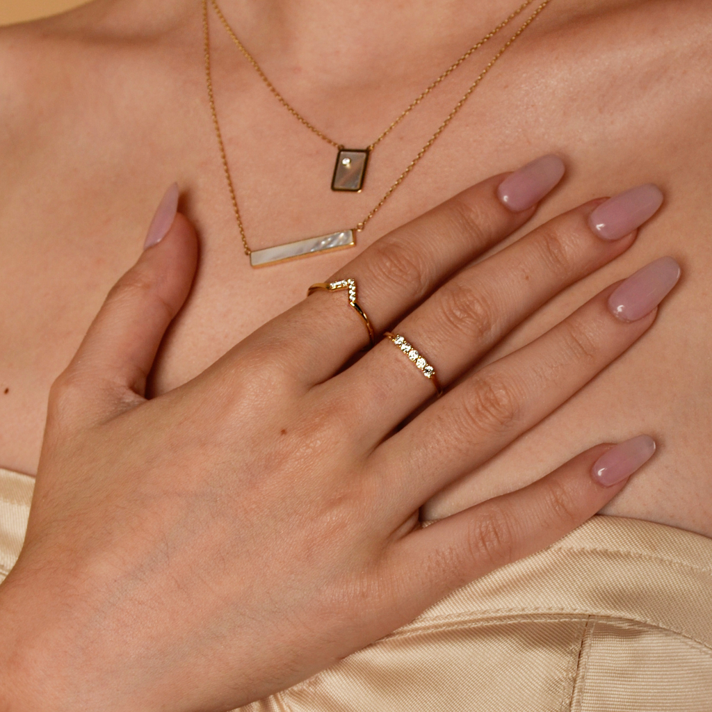 Wishbone Stacker Ring 14k gold stacked on model finger – Foundry