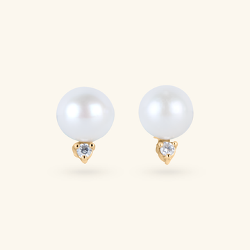 Diamond Pearl Studs, Handcrafted in 14k yellow gold. Set with freshwater pearls and diamonds in prong setting