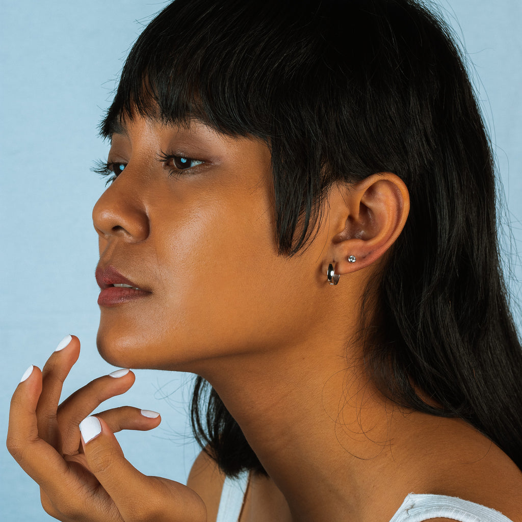 Bold Mini Hoop Earrings 18k white gold stacked  on model earrings – Foundry